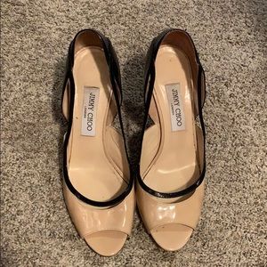 Jimmy Choo’s.  Peep Toe, tan and black.
